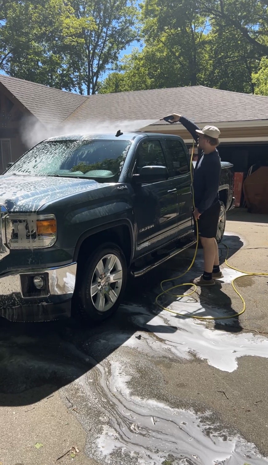 NorthLine Detailing team member washing a customer truck